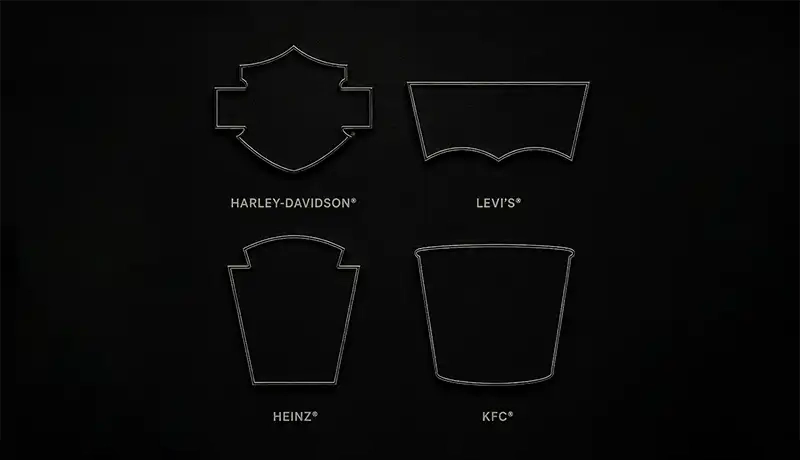 Outline illustrations of four brand shape marks on a black background with a red bottom border: Harley-Davidson's bar-and-shield, Levi's batwing pocket stitch, Heinz's keystone, and KFC's bucket silhouette